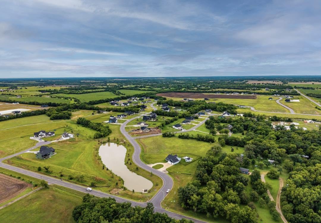 Aerial view of Cedar Ranch Estates in Derby, Kansas showing custom homes, ponds and spacious homesites